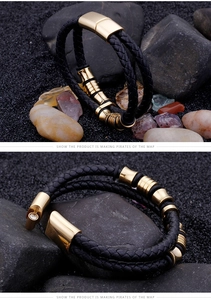 Detail of men's braided leather bracelet with golden stainless steel magnetic clasp