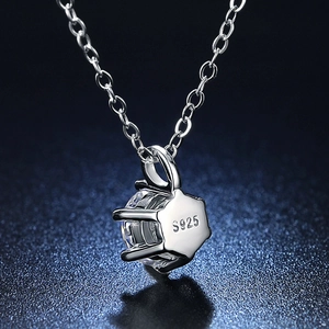 Macro shot of S925 sterling silver stamp and six-prong round moissanite pendant detail