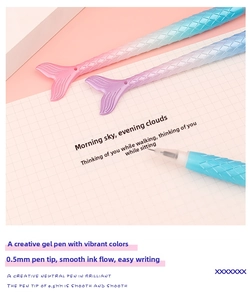 Detailed macro view of mermaid tail pens featuring gradient scales and a 0.5mm nib