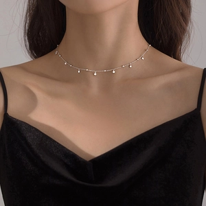 Minimalist silver choker necklace featuring multiple round sequin charms on a thin fine chain