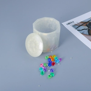 Detailed view of handmade octagon resin storage jar with glitter finish and pearls