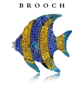 Macro detail of elegant fish brooch with vibrant blue and yellow rhinestones