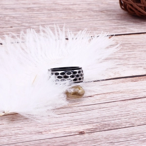 Detailed close-up of retro punk stainless steel ring with black honeycomb hollow pattern