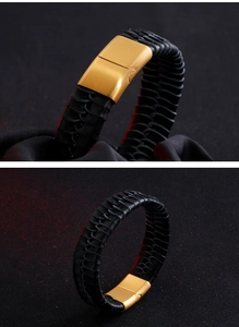 Detailed close-up of woven black leather bracelet with gold brushed metal buckle