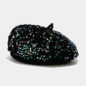 Detail of iridescent sequins on black beret hat with vibrant metallic reflection