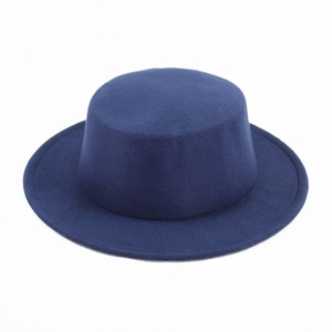 Overhead view of a dark blue wool felt boater hat with a flat top and classic wide brim