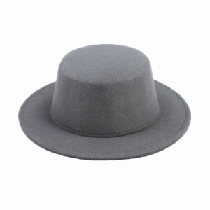 Detailed texture of a grey flat-top wool felt hat with round brim on white background