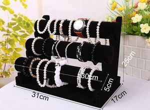 Three-tier black velvet jewelry display stand showing dimensions 31x17x25cm for watches