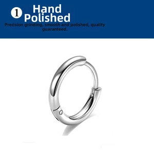 Close-up of hand-polished stainless steel hoop earring with shiny mirror finish and hinge