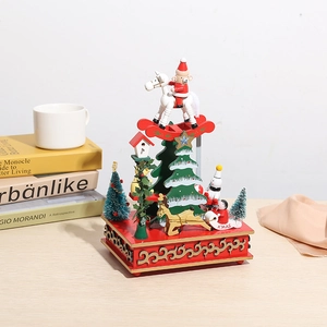 Boîte à musique de Noël en bois avec Père Noël et renne sur socle rouge festif