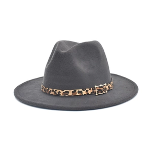 Detail of dark grey wool fedora hat featuring a leopard print belt and gold buckle