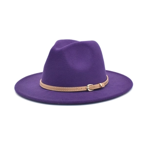 Close-up of a purple felt fedora hat featuring a brown leather band and gold metal buckle