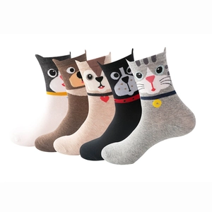 Close-up of five pairs of cotton crew socks featuring colorful cartoon animal patterns