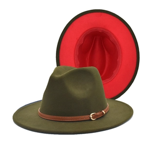 Detail view of two-tone wool fedora hat with green exterior and vibrant red lining