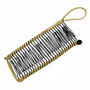 Detail of banana hair clip featuring beige rope weave and black wavy metal wire frame