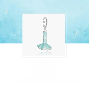 Macro detail of S925 sterling silver fishtail charm with light blue enamel and zircon inlay
