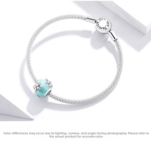 Detail of S925 silver mesh bracelet with blue snowflake charm and Family Forever clasp