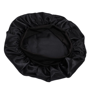 Detail showing the elastic band and glossy black satin texture of this sleep hair cap