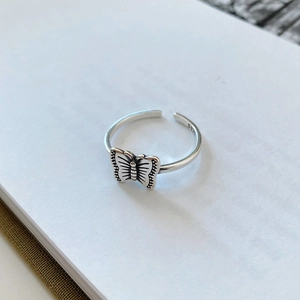 Macro shot of S925 sterling silver butterfly ring with vintage blackened texture detail
