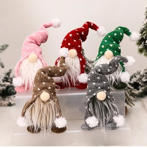 Detailed view of five Christmas gnomes with knitted heart hats and plush white beards