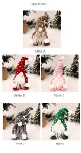 Detail view of five assorted knitted Christmas gnomes with heart patterned pointed hats