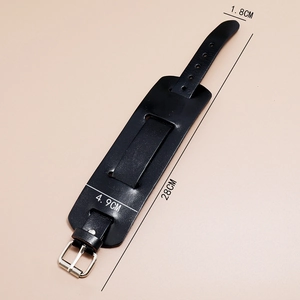 Detailed view of adjustable black leather punk wristband with dimension measurements
