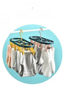 Detail of 12-clip drying rack for socks and underwear with windproof hook and pink clips