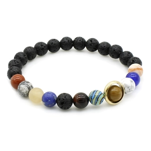 Macro shot of solar system bracelet with colorful natural stones and black lava beads