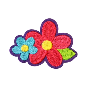 Self-adhesive embroidered flower patches with red and blue petals and green leaves