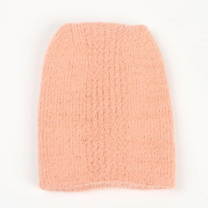 Close-up of pink faux mink beanie with sparkling gold silk yarn and ribbed knitting details