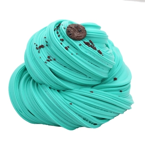 Macro detail of Tiffany blue butter slime with chocolate cookie charm and sprinkles