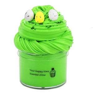 Detail of green scented butter slime in a jar with miniature bird eggs and soft sprinkles