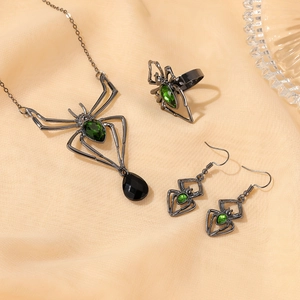 Gothic spider jewelry set with green emeralds including necklace, ring and earrings