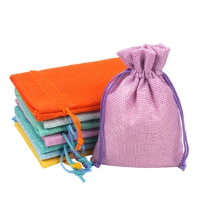 Colorful linen drawstring pouches for jewelry and makeup storage on a white background