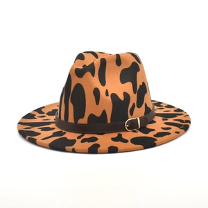 Classic cow print wool fedora hat with a leather band and gold buckle on white background