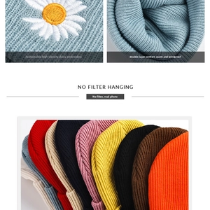 Detailed close-up of daisy embroidery on thick double-layer knit beanie hat