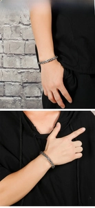 Detail view of retro Byzantine stainless steel chain bracelet on male model wrist