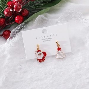 Asymmetric Christmas earrings featuring Santa and tree charms with 925 silver posts