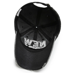 Internal view of distressed dark grey baseball cap with embroidery and washing labels