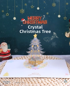 Detail of 3D crystal Christmas tree greeting card with gold stars and snowflake patterns