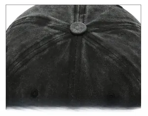 Macro shot of the durable six-panel crown stitching on a washed denim baseball cap