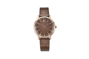 Detail of rose gold case and brown houndstooth pattern on the dial and watch strap