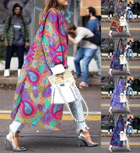 Detail of bohemian long coat with paisley pattern prints and wide folded cuffs