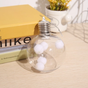 Clear Christmas bauble with LED string lights and white cotton balls for tree decor