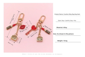 Detailed view of creative golden lipstick and heart purse keychains with dimensions