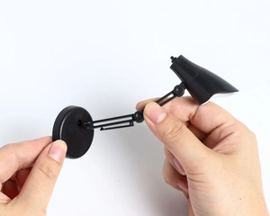 Mini lampe de lecture LED portable avec bras flexible tenue à la main