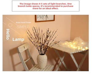 Detail of LED willow branch lights in a white textured vase for home decoration