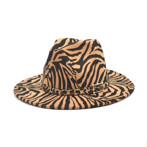 Detail of wide brim zebra print wool fedora with leopard band and gold buckle