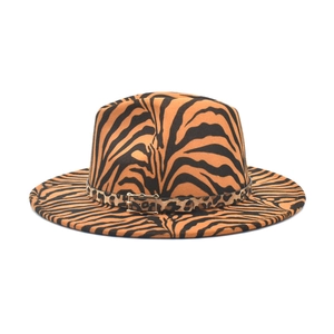 Tiger print wide brim fedora hat with leopard band and gold buckle on white background
