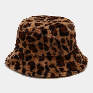 Detail shot of plush leopard print faux fur texture on a warm winter bucket hat